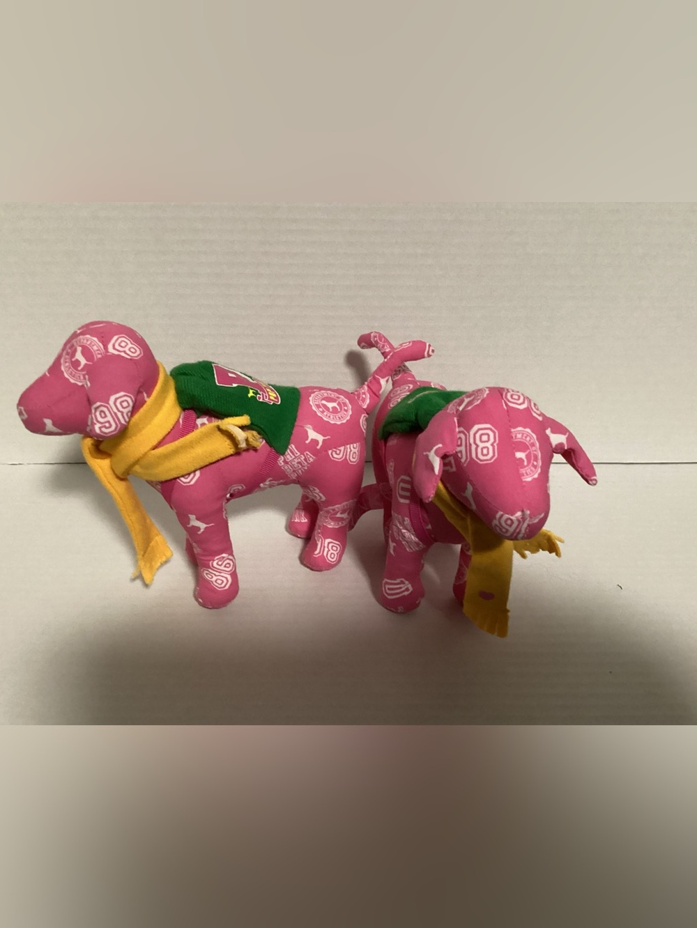 Pink Plush Dog Toy with Green Bandana and Yellow Scarf